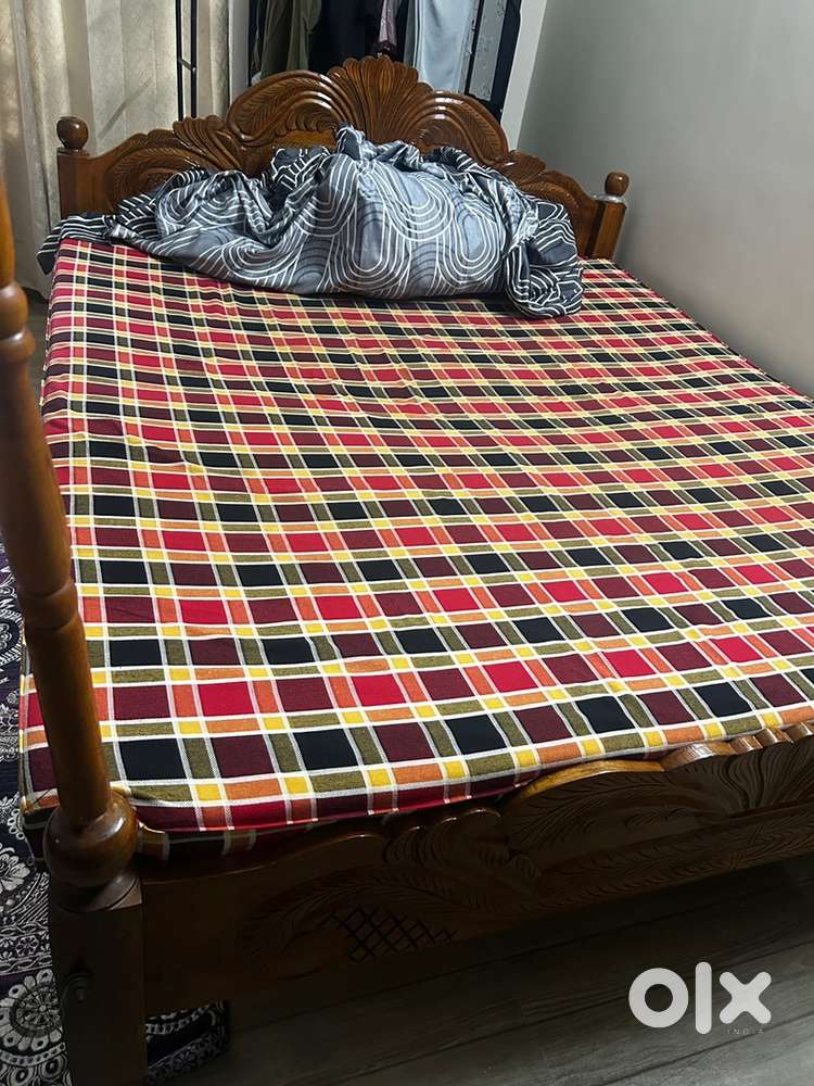 Queen size wood bed  and hand made mattress.