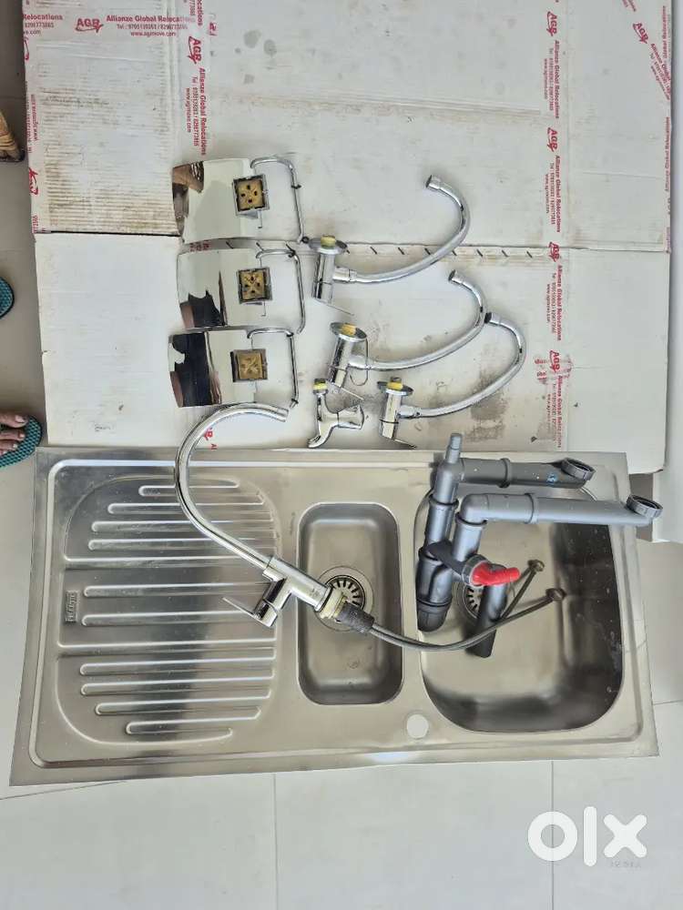 Stainless steel sinks,taps, drain pipe and toilet paper dispensers