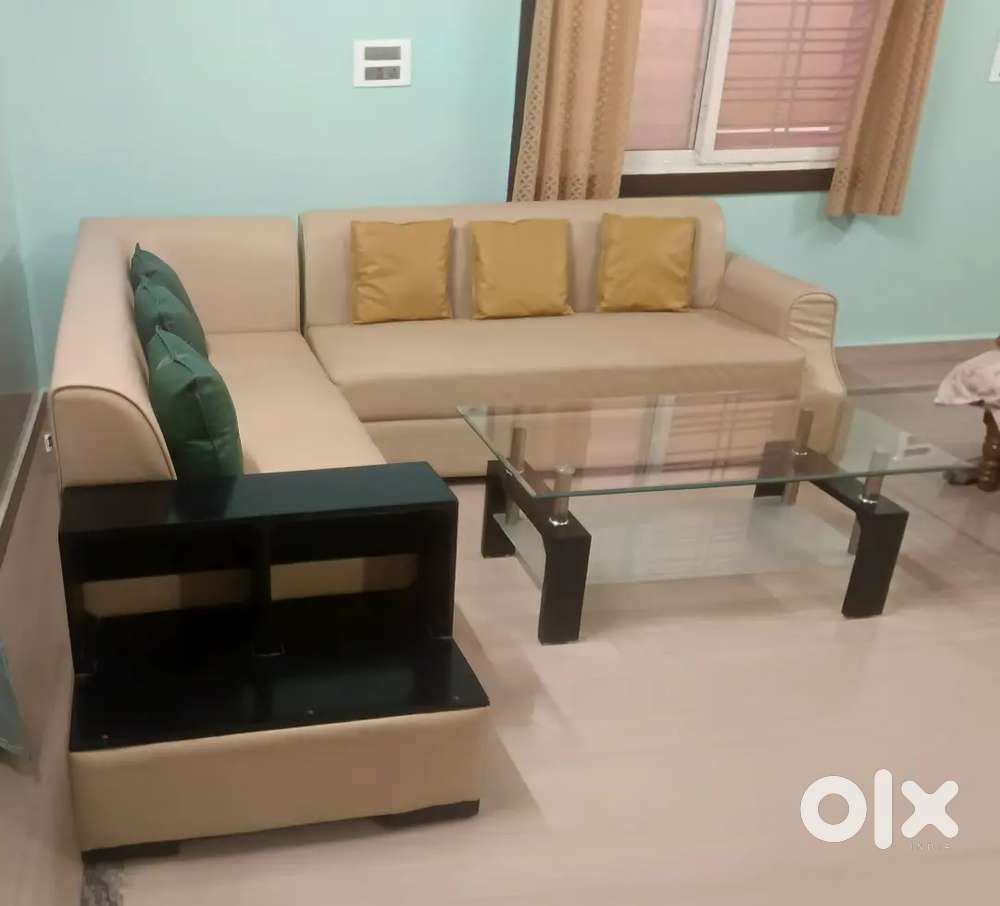 L sofa with glass tea poy