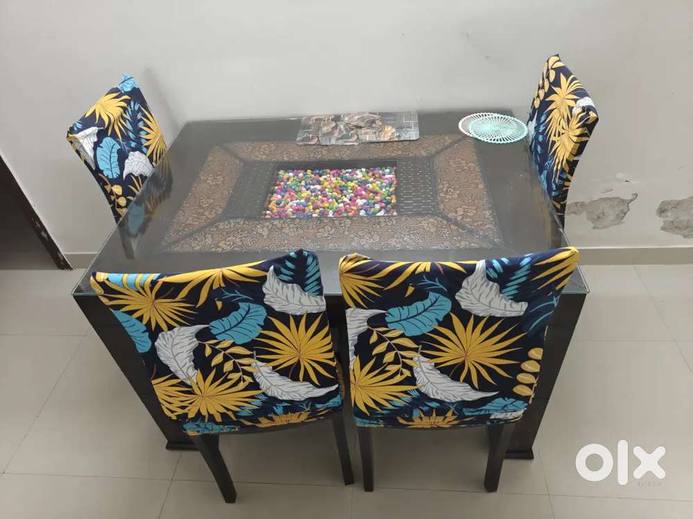4-Seater Dining Table with 4 Cushioned Chairs for sale