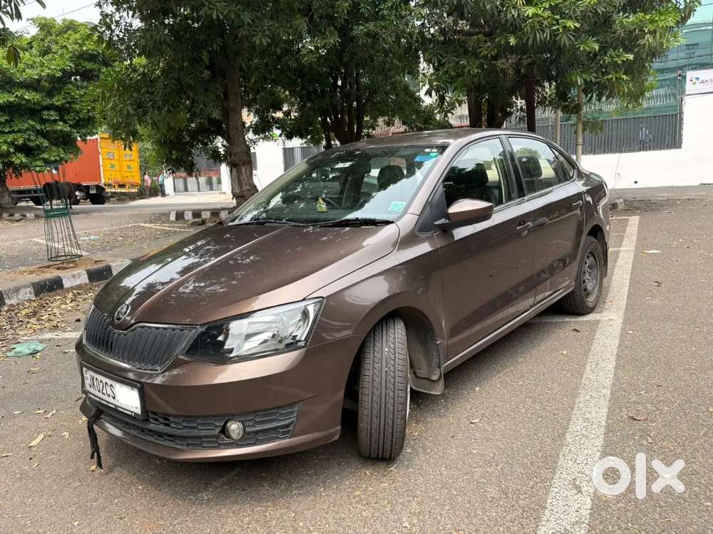 Brown Colour Skoda Rapid Turbro Charge Full Maintained Car