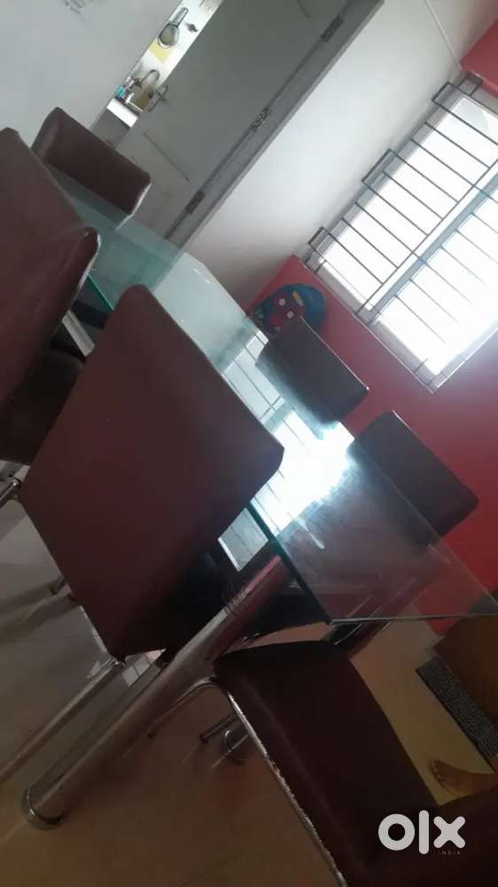 Glass dining table with 6 chairs