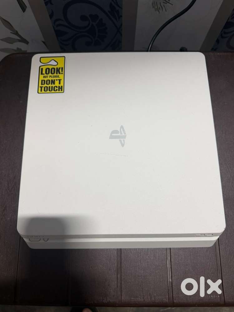 PS4 slim with games and controller