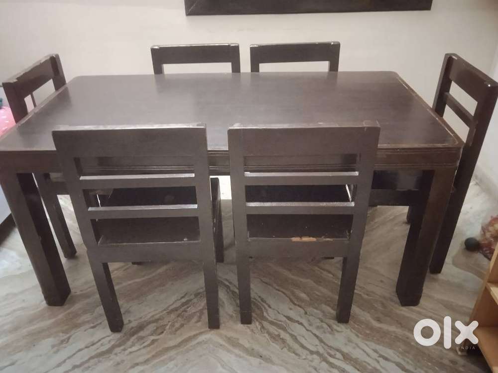 6 seater wooden dining table coffe color, curved corners. Sofa