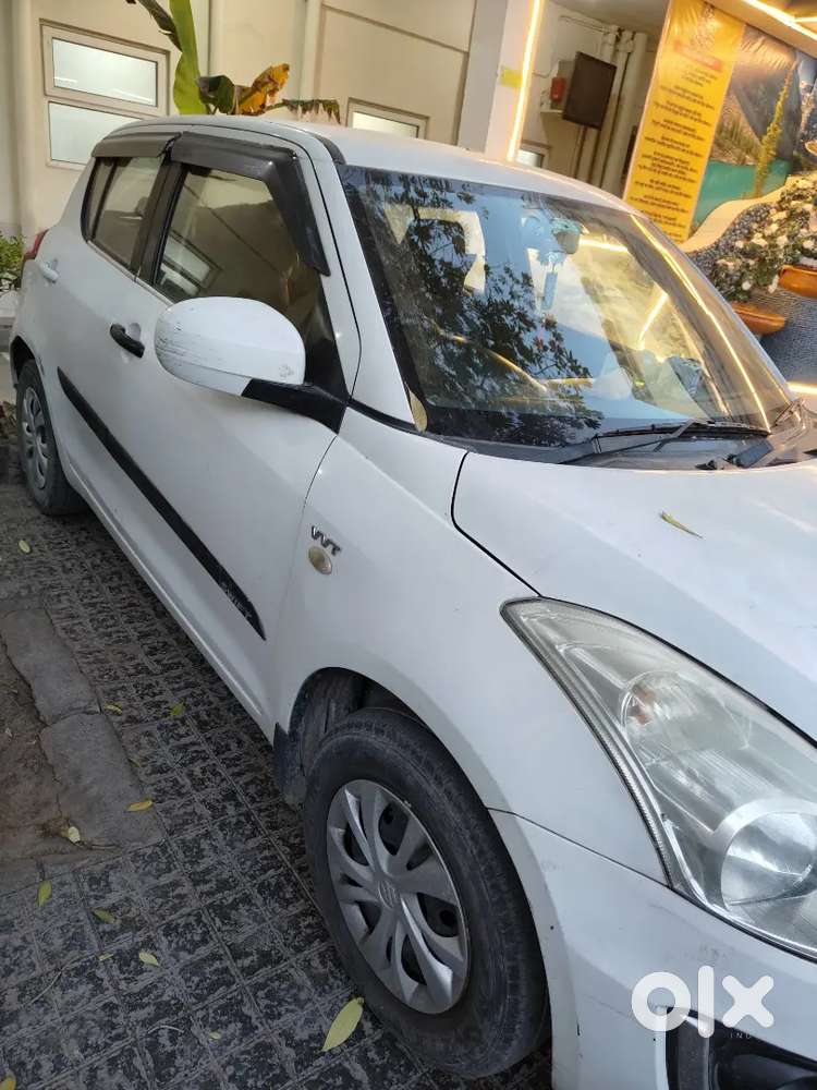 Swift Lxi 2027 White Color Good Condition.