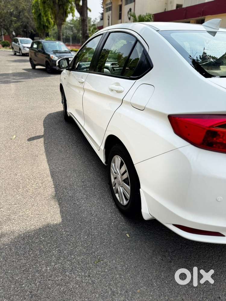 White Honda City - Officer Driven