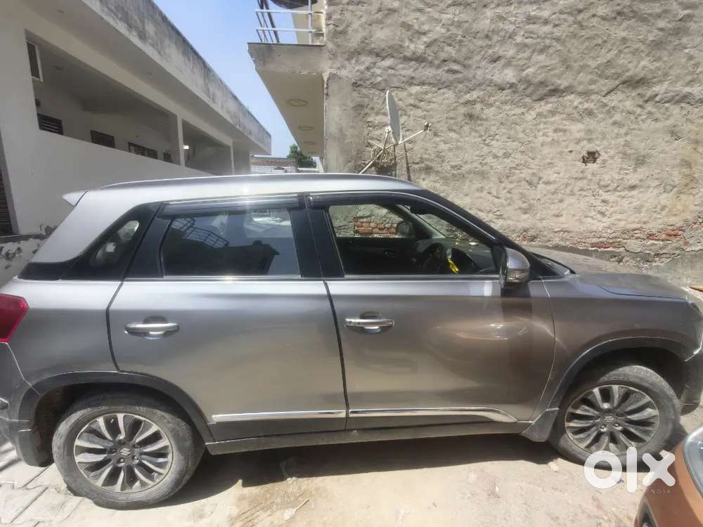 Maruti Brezza Zxi + Primium Silver Colour Excellent Condition.