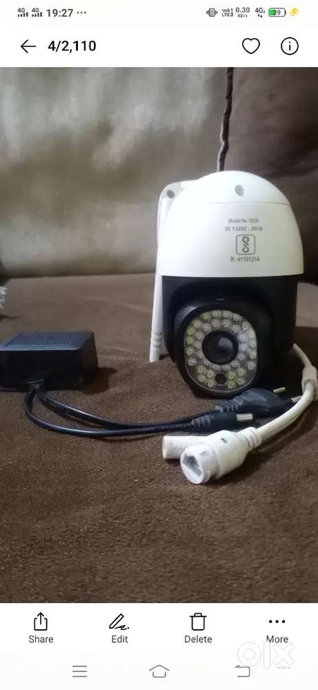 White and black plastic PTZ security camera with dual antennas. This u