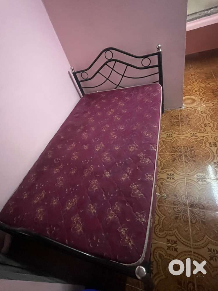 Steel cot along with bed