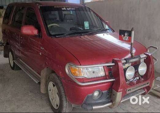 Well Maintained 2012 Red Tavera 10 Seater For Sale
