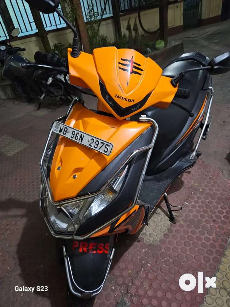 Honda dio price orange hot sale