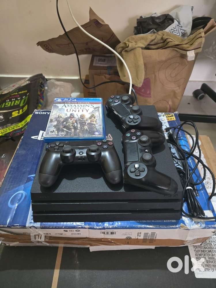 Sony PS4 Pro (1TB) with Game CDs Joysticks Excellent