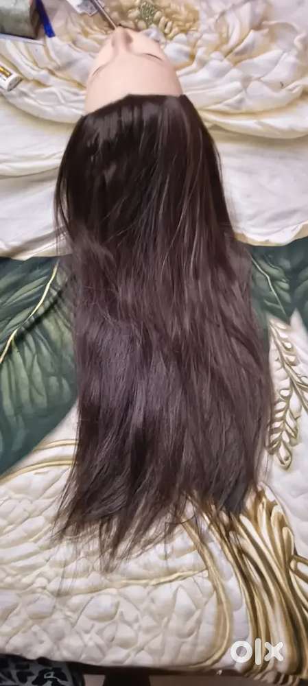 Beauty parlour training mannequin head with long black hair for sale.