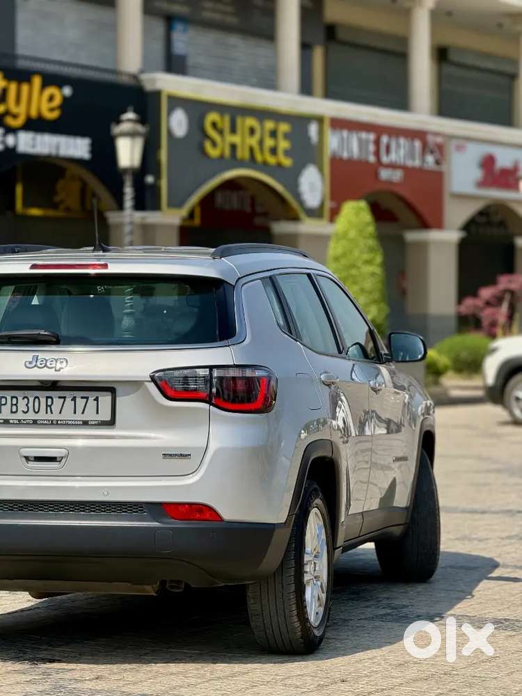 Jeep Compass 4x4 Next To Showroom