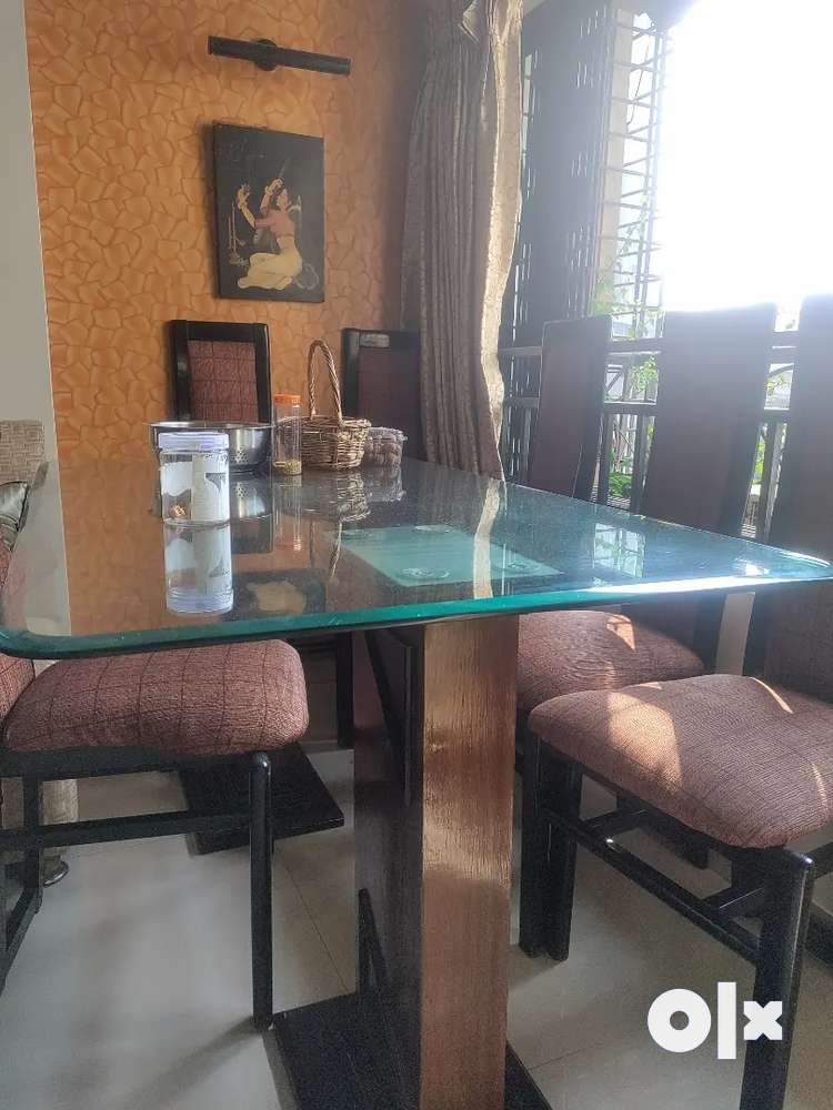 Dining table with glass deals top and pebbles