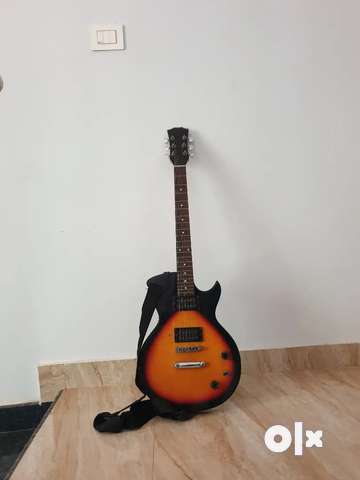 Second hand deals guitar olx