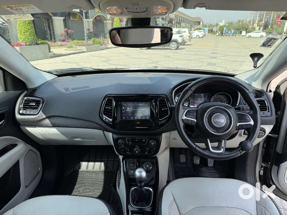 Jeep Compass 4x4 Next To Showroom