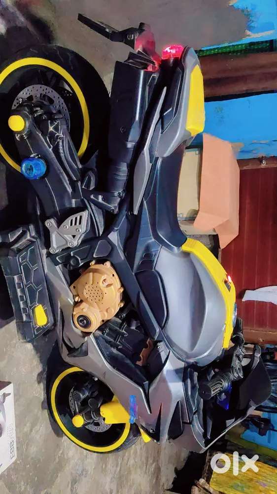 Childrens rider bike in good condition, new battery