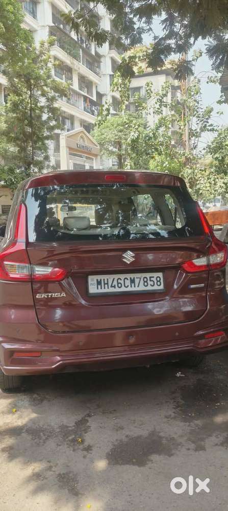 Ertiga Smart Hybrid Vxi (o) , Colour -prme. Auburn Red