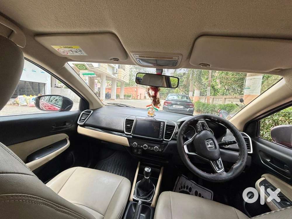 5th Generation Red Colour Honda City V Model Driven By A Ca