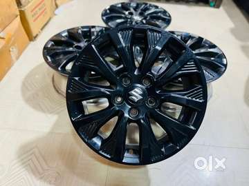 Brezza vxi deals alloy wheels price