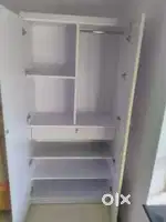 A 2 door white wardrobe/cupboard with Hanging Rod
