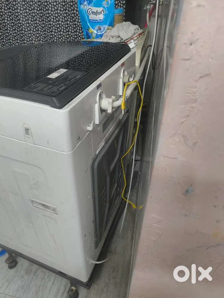 Bosh top load 7 kg washing machine working condition less used