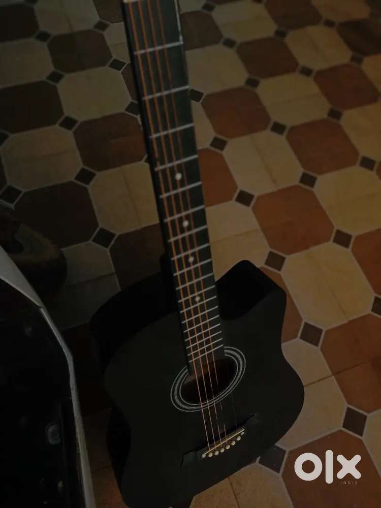 Guitar with 1 broken string for beginners only medellin company guitar