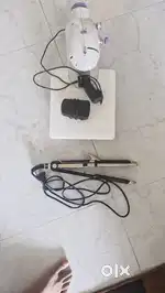 Straightener and sewing machine