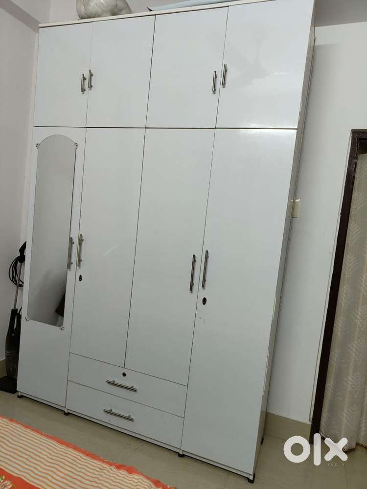 It is made of MDF board”, white colour attached mirror