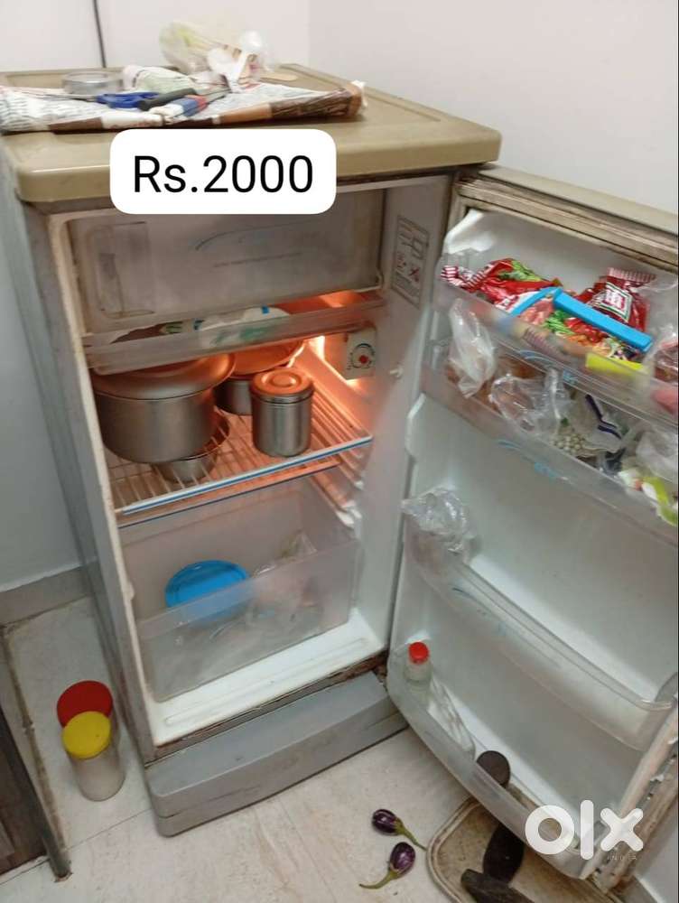 Refrigerator and Wooden Cupboard TV