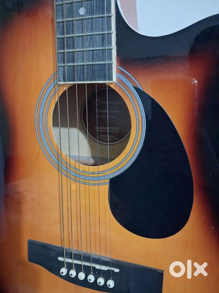 Selling my acoustic  guitar with hanging  stand belt And guitar bag