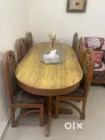 Six seater teak wood oval dining table in good condition