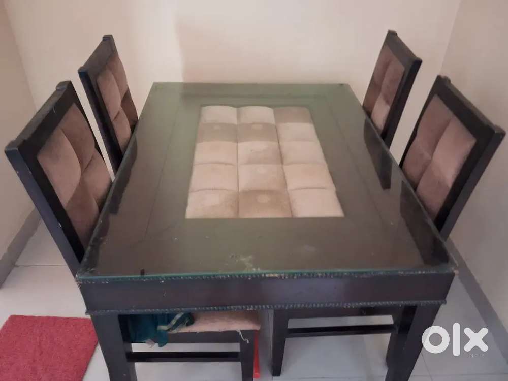 4 seater solid wooden dining table in new condition.