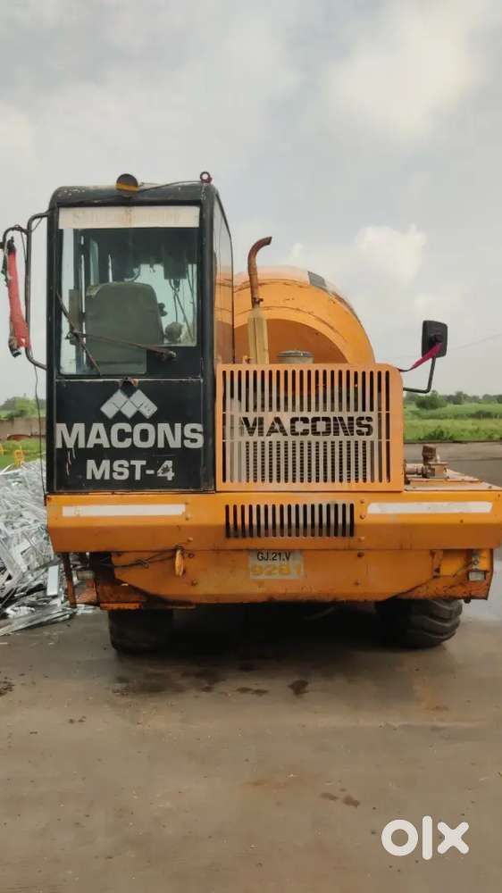 Self loading concrete mixer