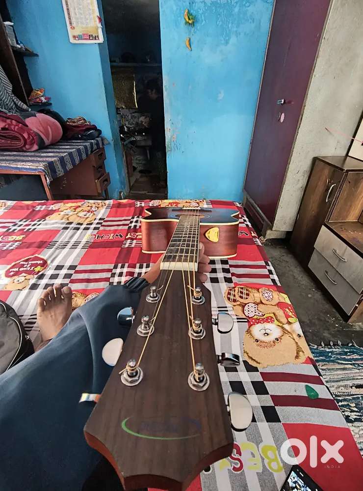 Guitar selling good condition techno guitar with capo pick bag pack