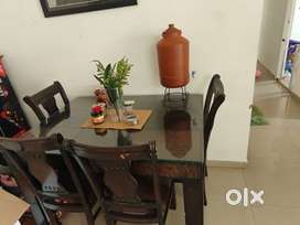 4 seater wood dining table with glass top