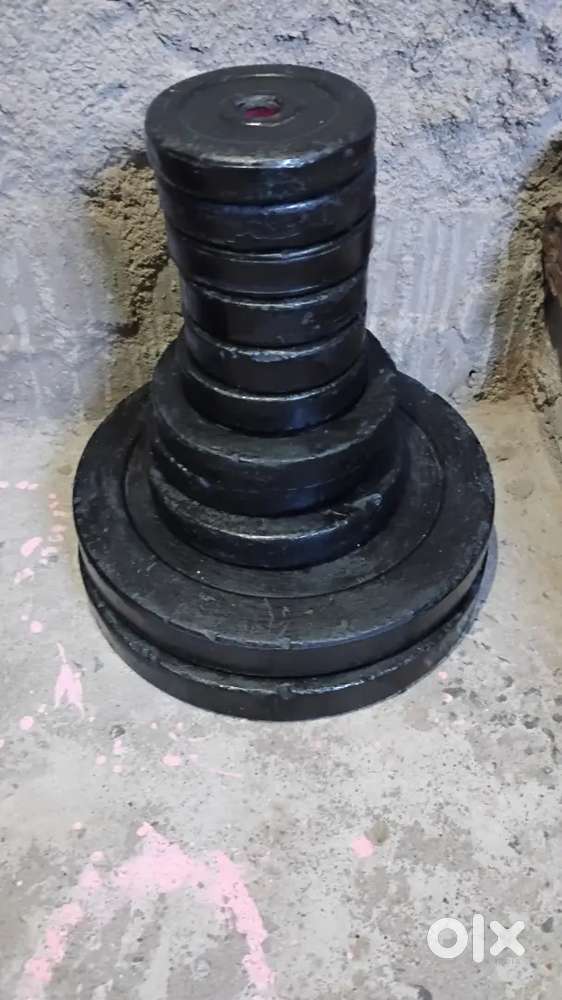 Barbell and plates and abs machine