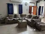 7 seater sofa with Glass  table and two square chairs