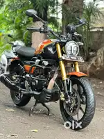 TVS RONIN ORENGE BLACK COLOUR