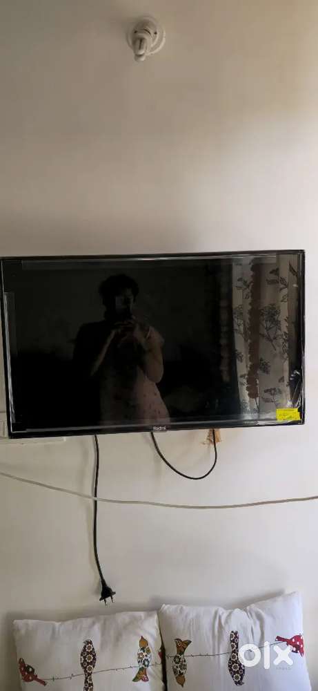32 Inch Redmi TV with wall mount stand.