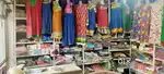 A cloth shop with furniture and Racks