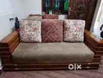 Three seater wooden sofa