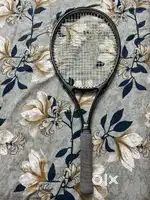Tennis racket with bag and ball cans