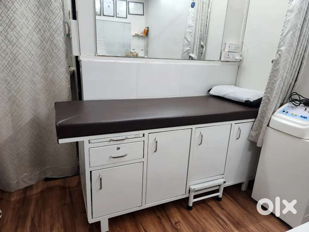 Patient checking bed , waiting area two tables