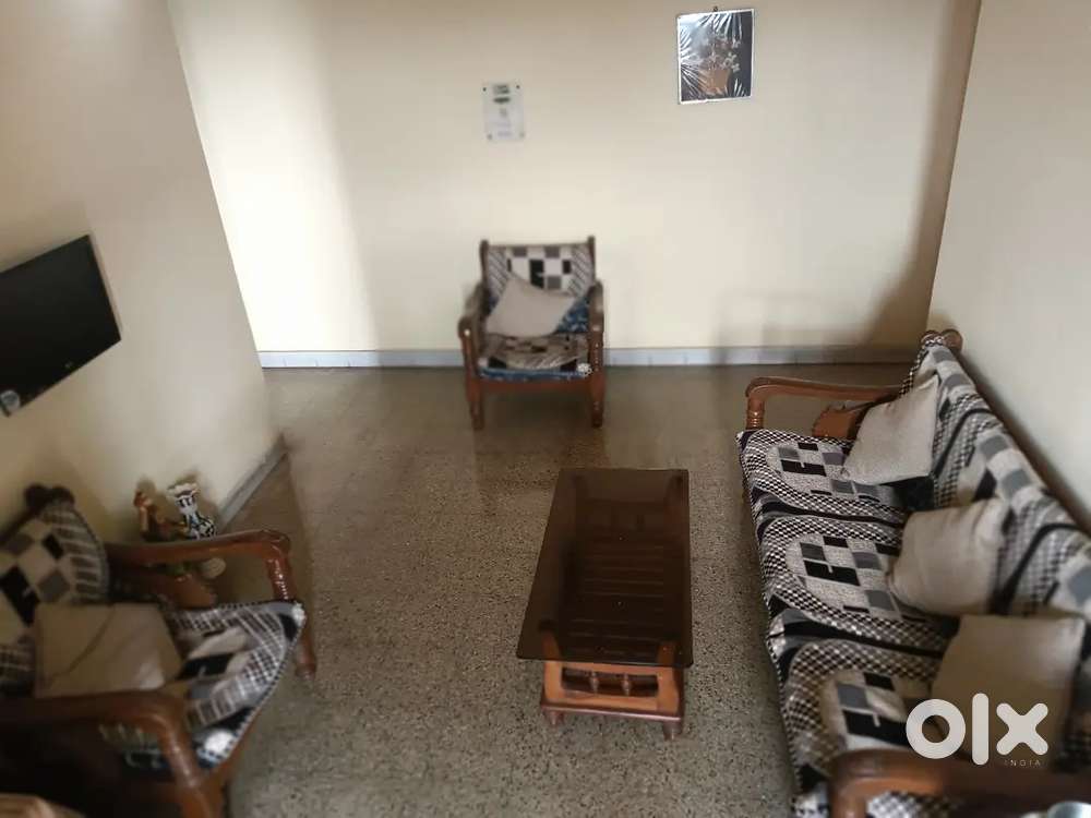 3 + 2 Teakwood sofa set along with coffee table 33000/-