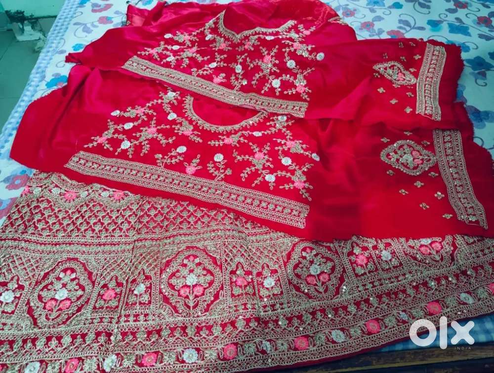 Embroidered Semi Stitched Lehenga Choli in Red and Gold.