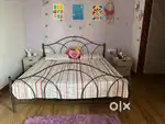 Iron bed with curl on matteress