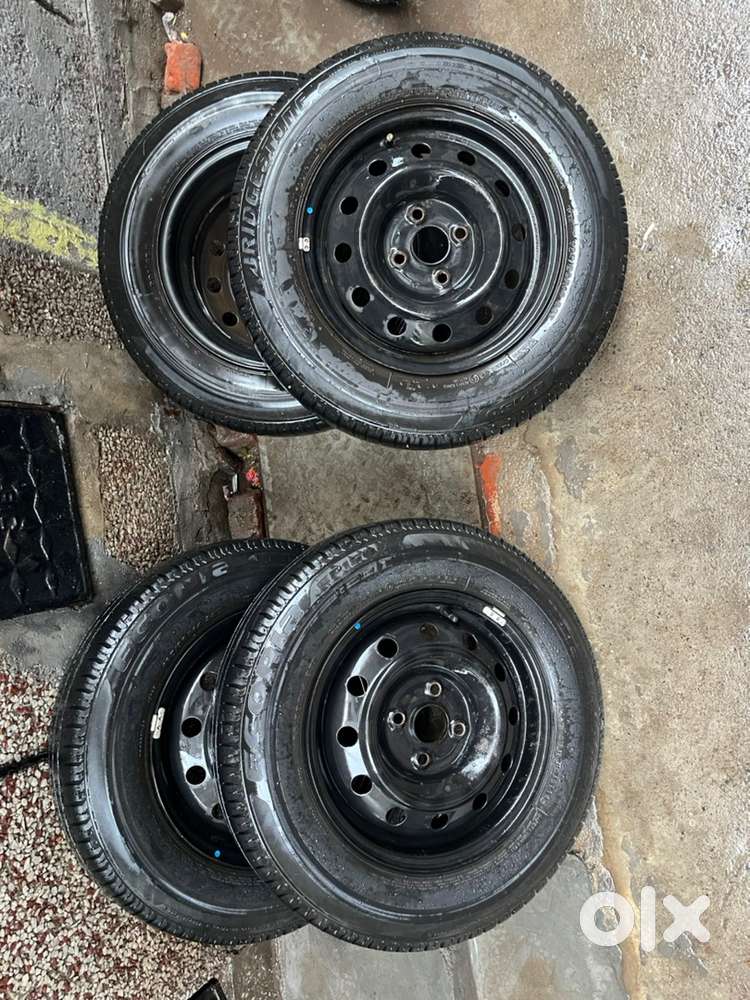 Swift dzire rims tyres Bridgestone 14 inch okay condition tyres