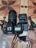 Nikon D7100 with 70-300 lance.  Battery.  Charjar . Bag .